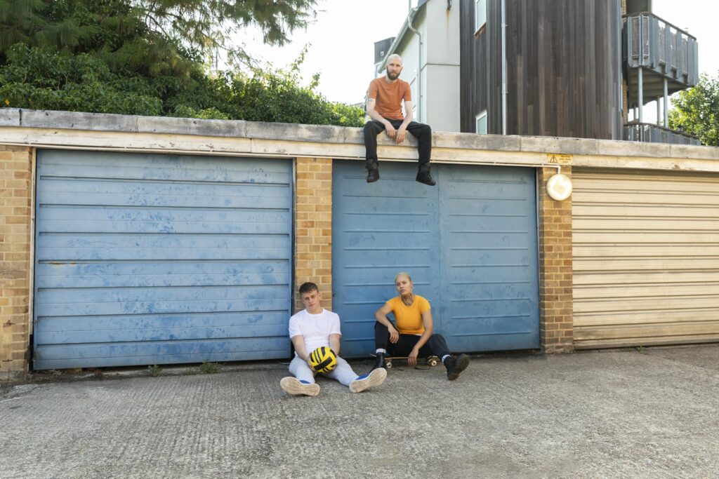 long-shot-friends-sitting-outdoors